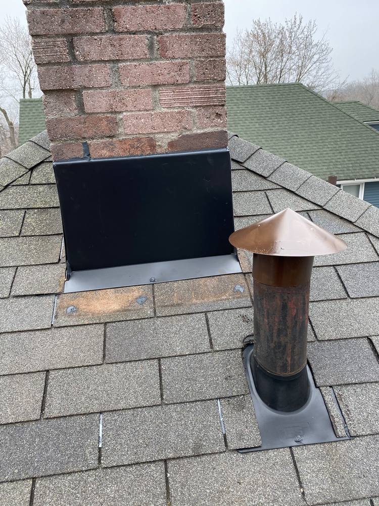 Chimney and Flue Pipe Re-Flash in West Michigan — photo 12 of 15