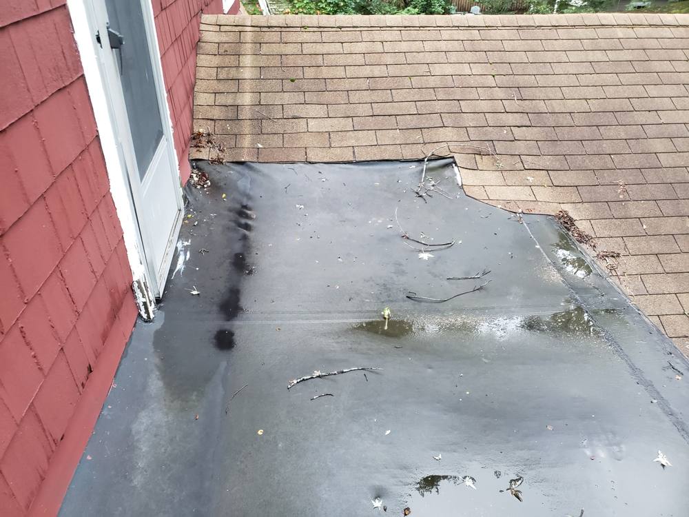 EPDM Flat Roof and Door-to-Window Conversion in West Michigan — photo 4 of 13