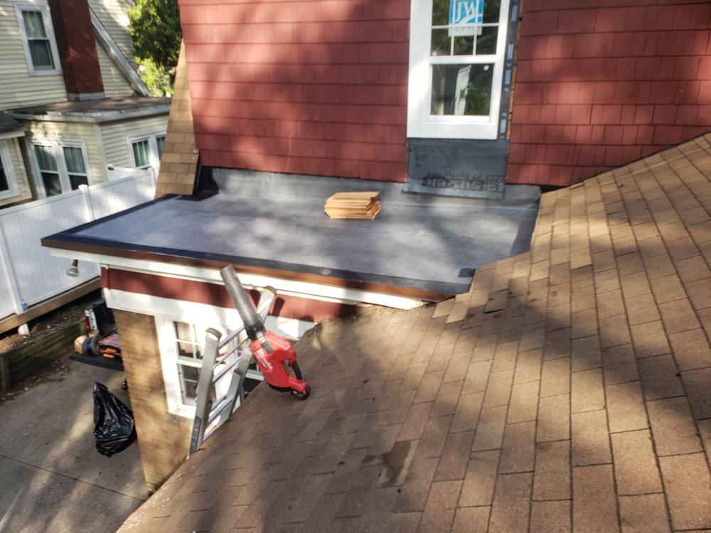 EPDM Flat Roof and Door-to-Window Conversion in West Michigan — photo 11 of 13